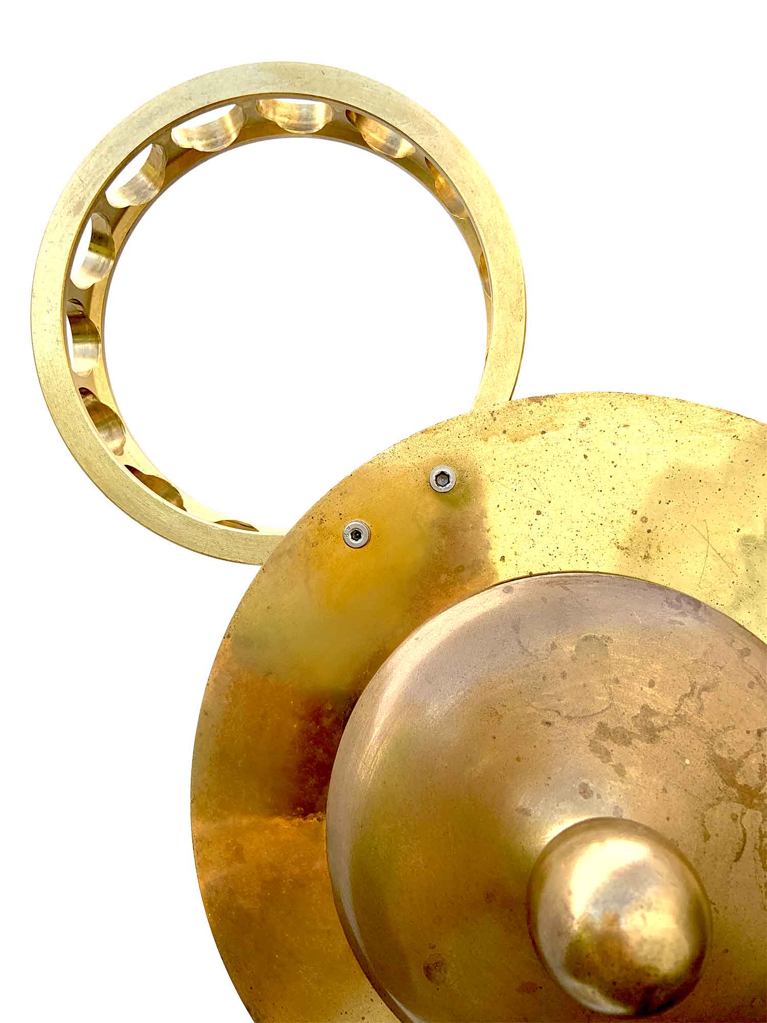 A sculpture with a face formed by a sphere with a knob for a nose and industrial brackets for ears, it has a base from which a stem surges that supports the head – detail.